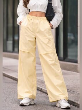 RAINS Suva Hardshell Pants Wide in “Gleam yellow womens unisex medium waterproof